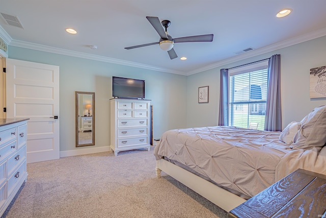 carpeted bedroom featuring ornamental molding and ceiling fan