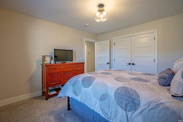 bedroom with a closet and carpet floors