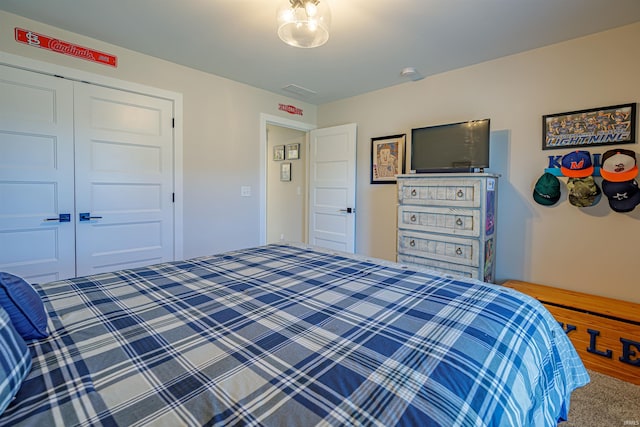 carpeted bedroom with a closet