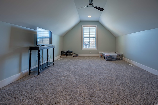 additional living space with lofted ceiling, carpet flooring, and ceiling fan