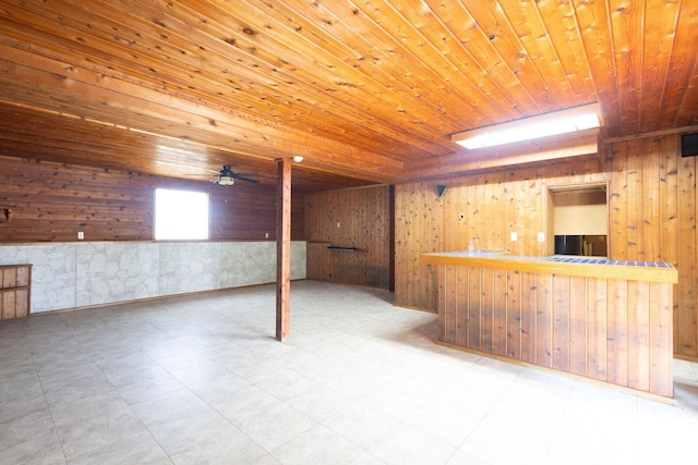 4299 E 1000 N, Roanoke, IN 46783 - below grade area featuring wood walls, wood ceiling, bar area, a ceiling fan, and tile patterned floors