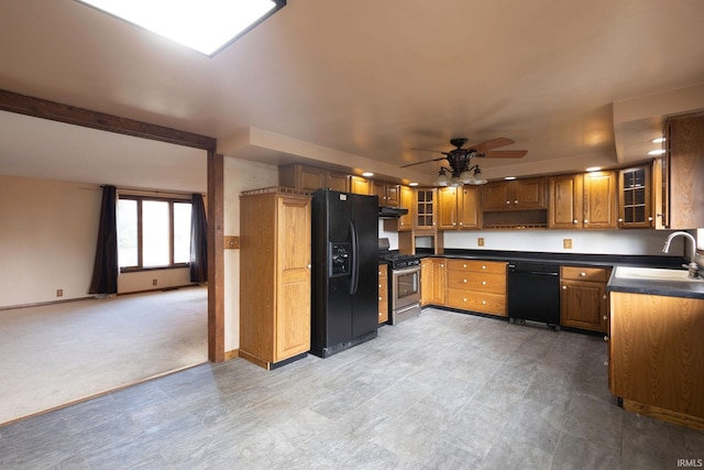 4299 E 1000 N, Roanoke, IN 46783 - kitchen featuring black appliances, a sink, dark countertops, ceiling fan, and brown cabinets