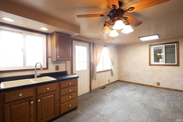 4299 E 1000 N, Roanoke, IN 46783 - kitchen with a sink, dark countertops, baseboards, a ceiling fan, and recessed lighting