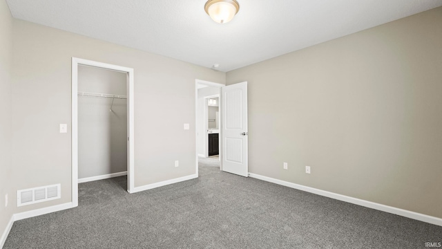 unfurnished bedroom featuring a closet and carpet