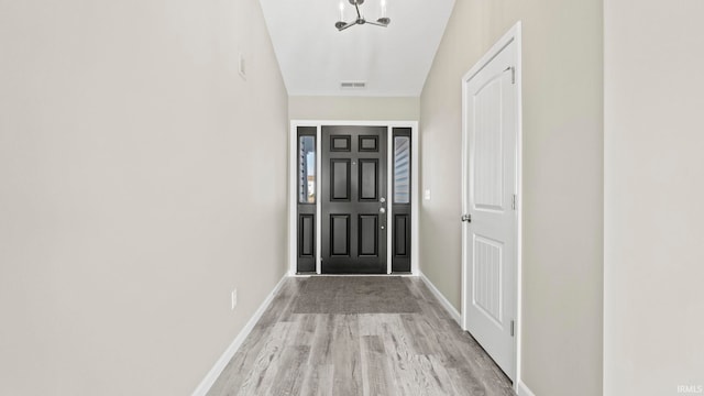 entryway with light hardwood / wood-style floors