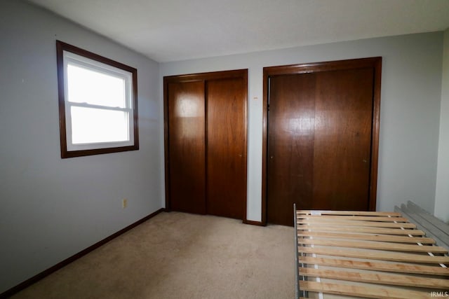 unfurnished bedroom with light carpet