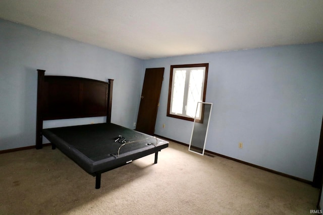 unfurnished bedroom with light colored carpet