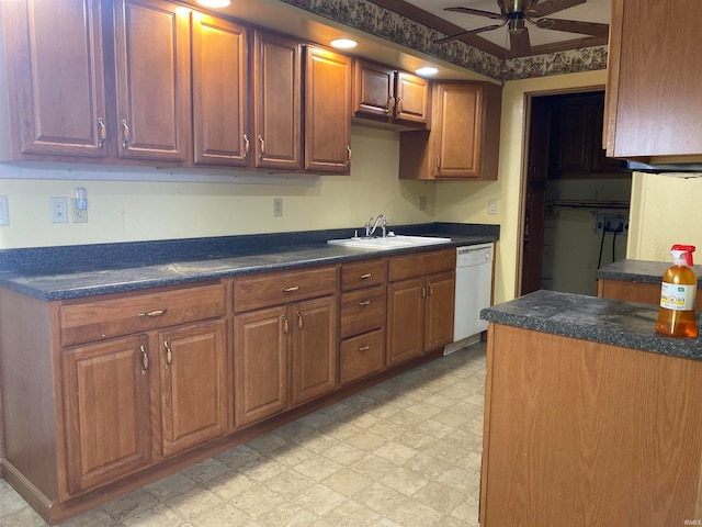 kitchen with white dishwasher, ceiling fan, and sink