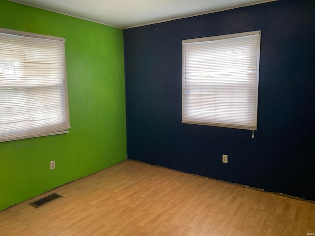 unfurnished room featuring light hardwood / wood-style flooring