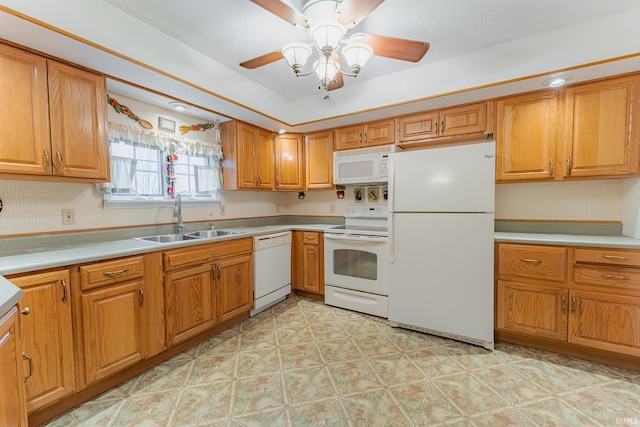 kitchen featuring tasteful backsplash, white appliances, sink, and ceiling fan