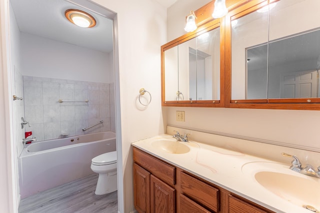 bathroom featuring vanity, hardwood / wood-style flooring, and toilet