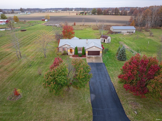 birds eye view of property with a rural view