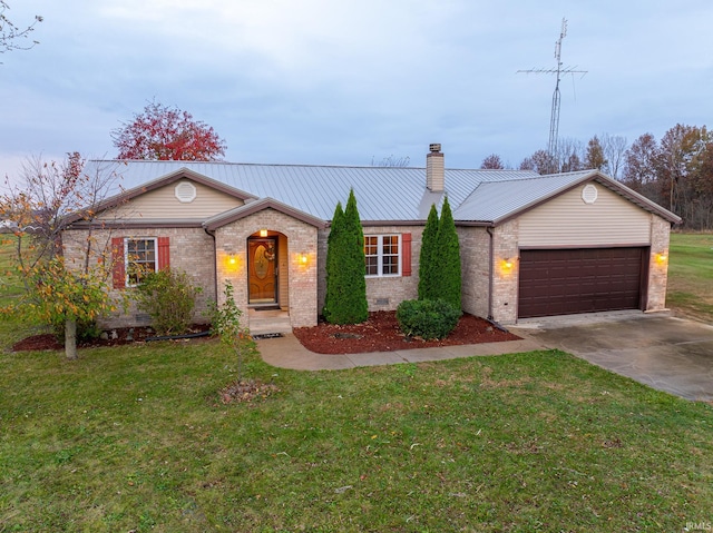 ranch-style home with a garage and a front yard