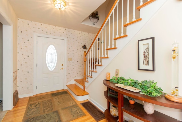 foyer entrance featuring hardwood / wood-style flooring