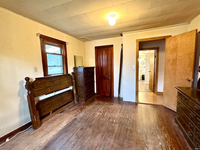 bedroom with hardwood / wood-style flooring