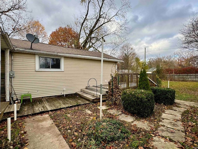 view of home's exterior featuring a wooden deck