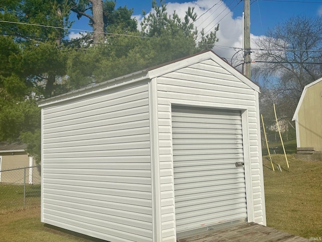 view of outbuilding with a lawn