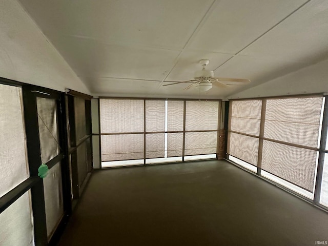 unfurnished sunroom featuring ceiling fan