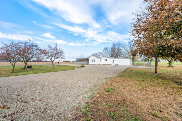 view of front of house with a garage and a front lawn