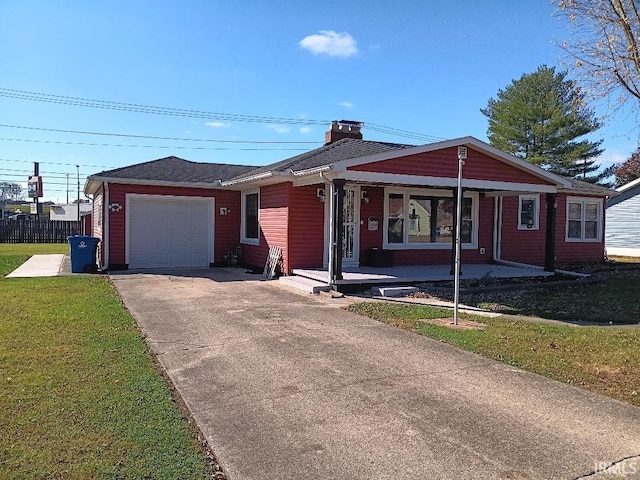 single story home featuring a front lawn and a garage