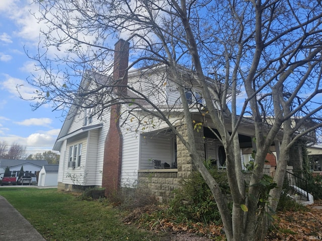 view of home's exterior with a lawn