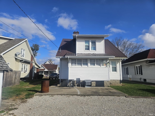 back of house with a patio area