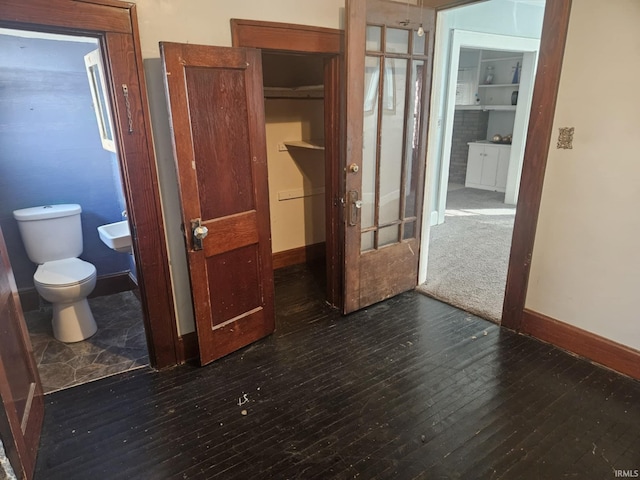 hallway featuring dark hardwood / wood-style floors