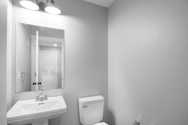 bathroom featuring sink and toilet