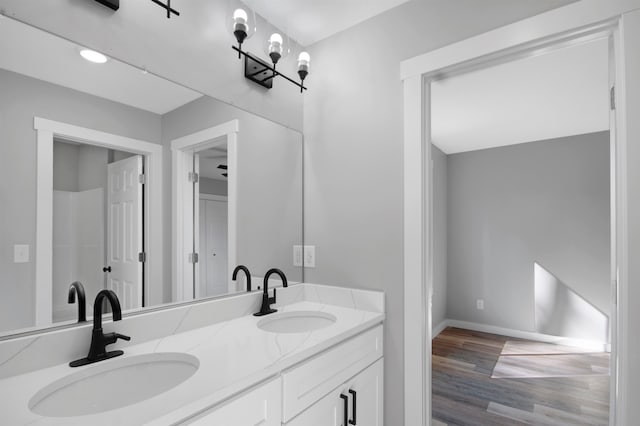 bathroom with vanity and hardwood / wood-style flooring