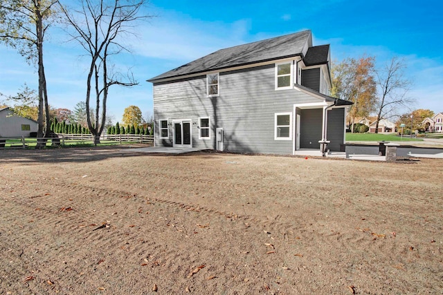 back of house with a patio