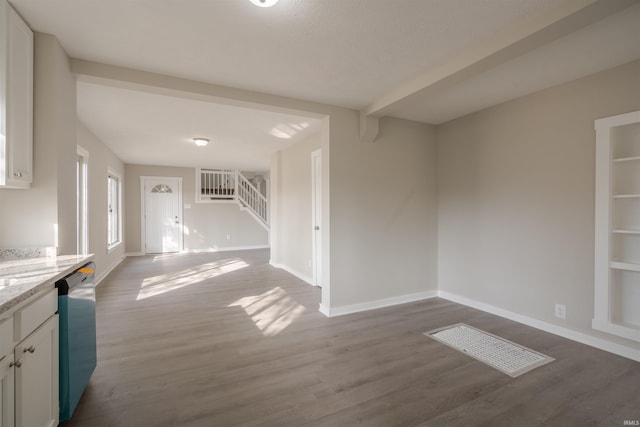 unfurnished living room with dark hardwood / wood-style flooring