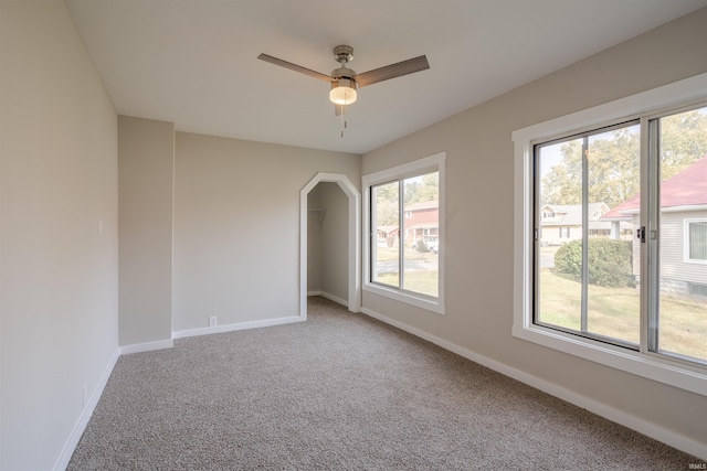 carpeted empty room with ceiling fan