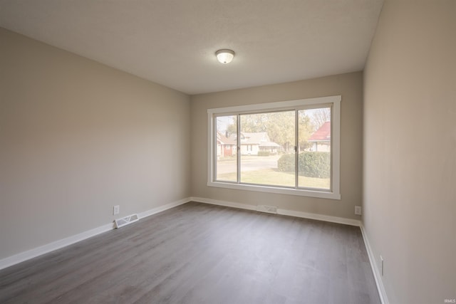 empty room featuring hardwood / wood-style floors