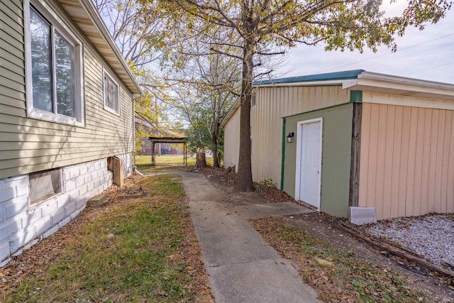 view of side of property with a carport