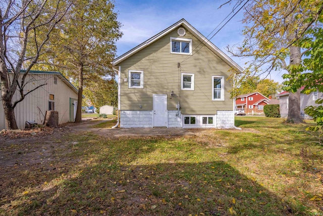 rear view of house with a yard