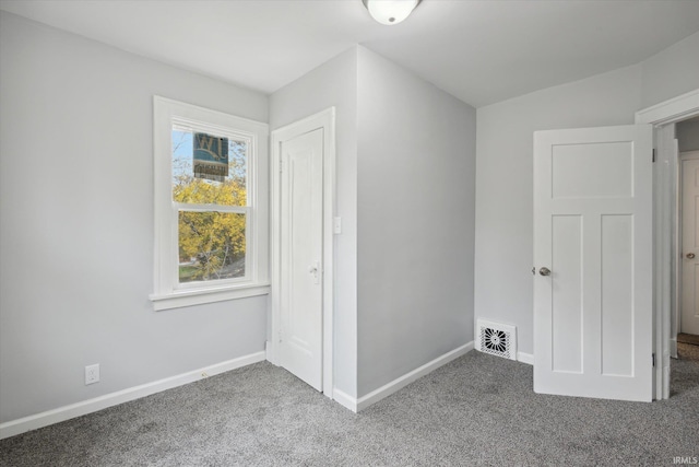 unfurnished bedroom with carpet flooring