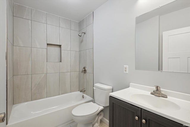 full bathroom with toilet, tiled shower / bath combo, and vanity