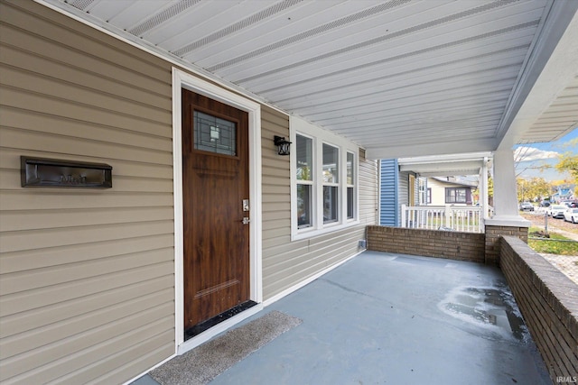 property entrance with covered porch