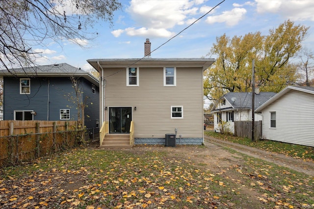 rear view of house with central AC