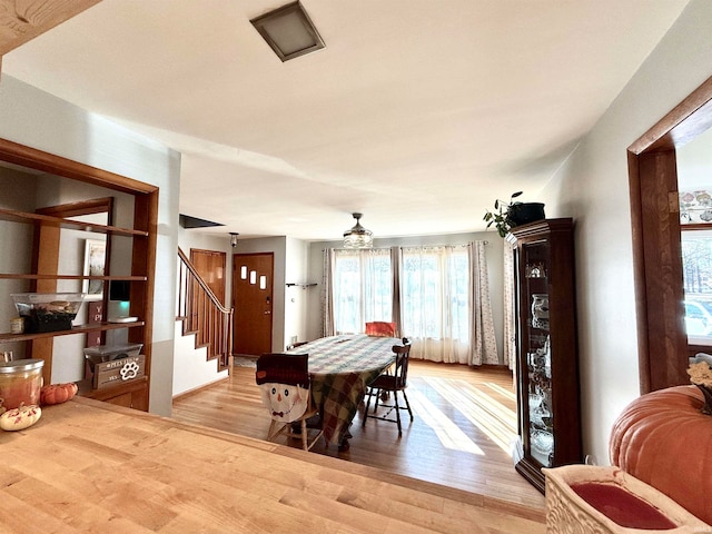 dining space with light hardwood / wood-style floors