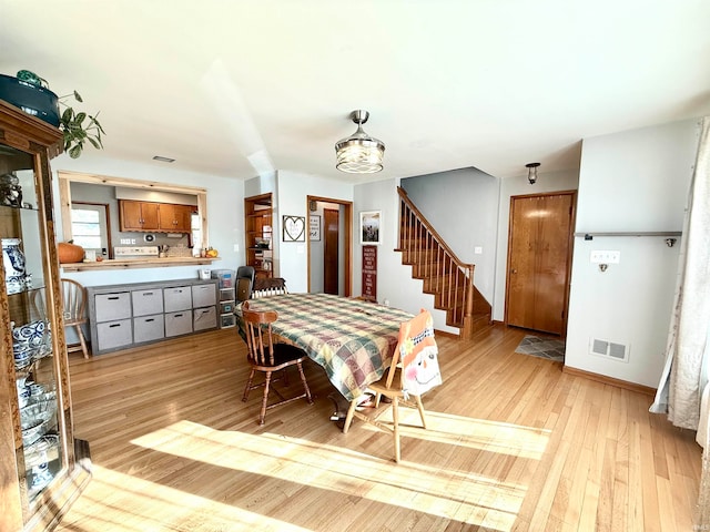 dining area with light hardwood / wood-style flooring