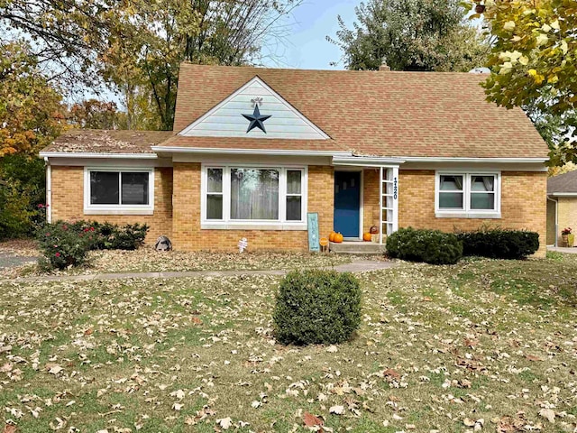 view of front of home with a front lawn