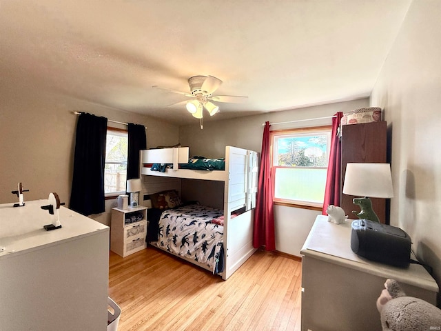 bedroom featuring ceiling fan and light hardwood / wood-style flooring