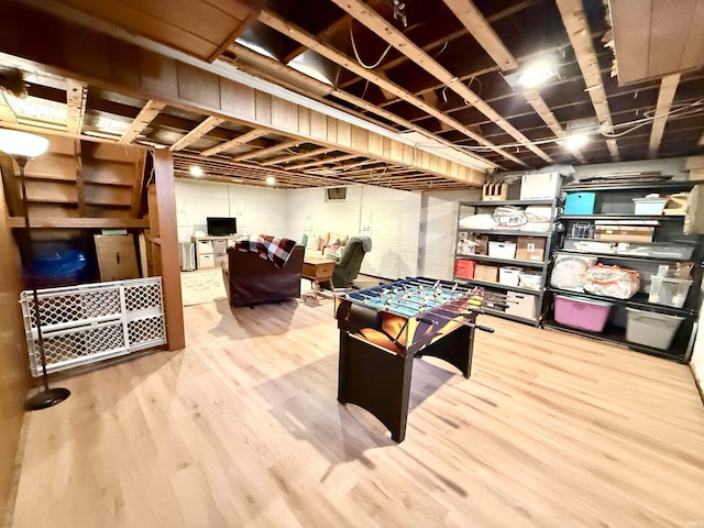 rec room with hardwood / wood-style flooring