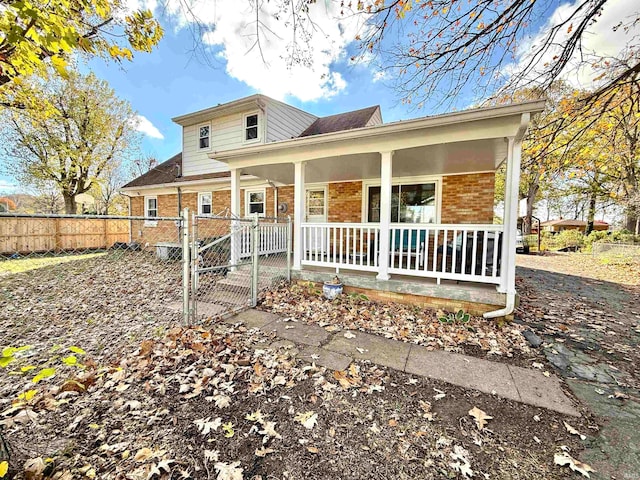 rear view of house with covered porch