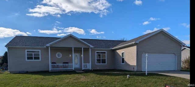 single story home featuring a garage and a front lawn