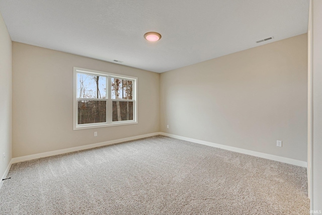 empty room with carpet flooring