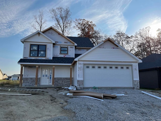 view of front of house with a porch and a garage