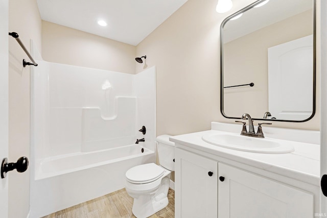 4805 Falcon Pkwy, New Haven, IN 46774 - full bathroom with toilet, vanity, shower / washtub combination, and wood finished floors