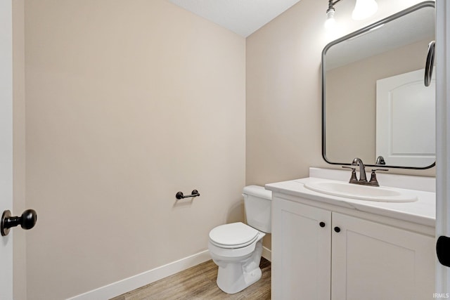4805 Falcon Pkwy, New Haven, IN 46774 - bathroom with wood finished floors, baseboards, vanity, and toilet